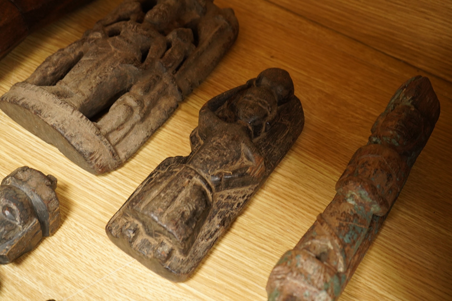 A group of Indian carved figures of deities, largest 42.5cm